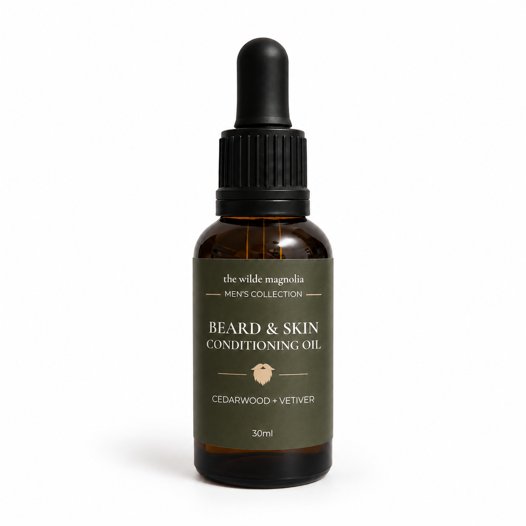 Amber dropper bottle with olive green label saying "Beard & Skin Conditioning Oil. Cedarwood + Vetiver" on a white background
