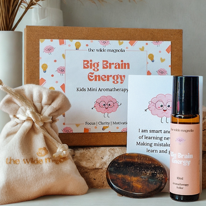 Collection of 'Big Brain Energy' kids mini aromatherapy products from Wilde Magnolia on a neutral background.