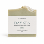 A single rectangular botanical cleansing bar wrapped in a white paper label reading 'the wilde magnolia DAY SPA White Sage | Ylang Ylang | Litsea Fresh Botanical Cleansing Bar 120g', photographed on a clean white background.