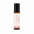 A 10ml amber glass rollerball bottle with a black cap and a cream-colored label. The label features the scent name 'Goddess' in a pink font, along with 'Empower + Glow'.