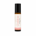 A 10ml amber glass rollerball bottle with a black cap and a cream-colored label. The label features the scent name 'Goddess' in a pink font, along with 'Empower + Glow'.