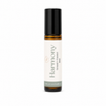A 10ml amber glass rollerball bottle with a black cap, and a cream-colored label. The label features the brand name 'the wilde magnolia' and the scent name 'Harmony'.