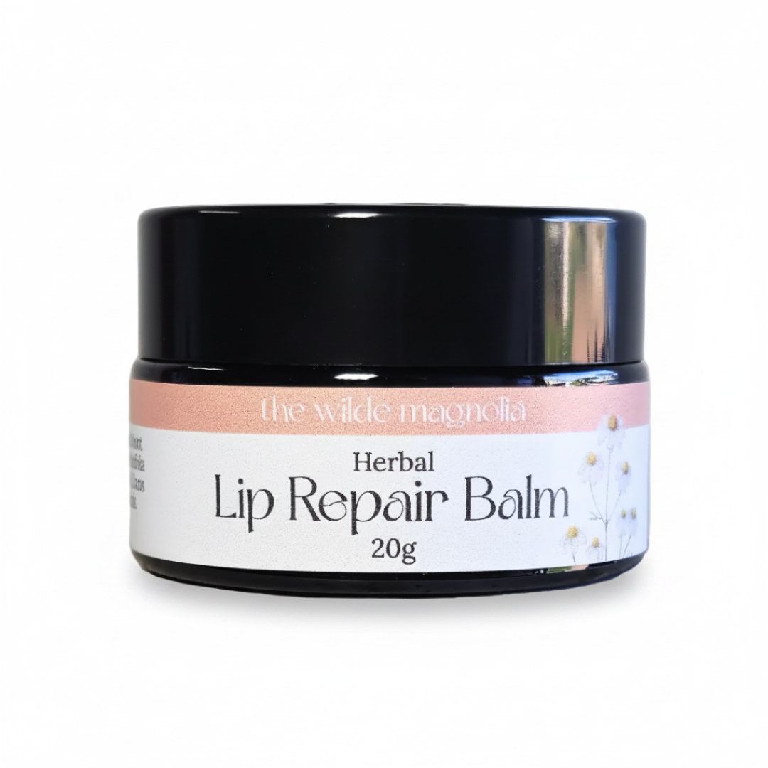 Jar of Herbal Lip Repair Balm by the wilde magnolia on a white background