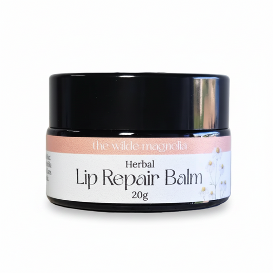 Jar of Herbal Lip Repair Balm by the wilde magnolia on a white background