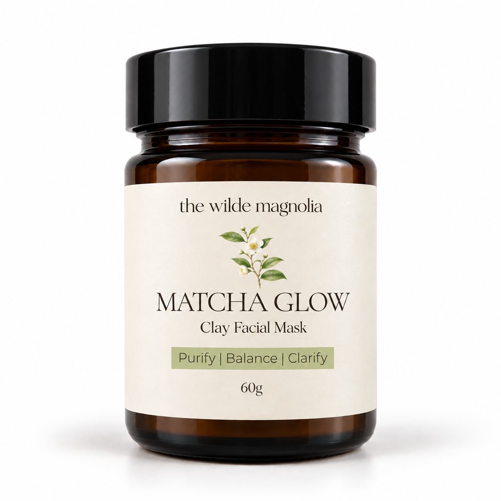 An amber glass jar on a white background with a label that reads Macha Glow Clay Facial Mask. Purify, Blance, Clarify