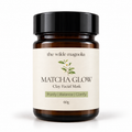 An amber glass jar on a white background with a label that reads Macha Glow Clay Facial Mask. Purify, Blance, Clarify