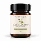 An amber glass jar on a white background with a label that reads Macha Glow Clay Facial Mask. Purify, Blance, Clarify