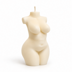 An ivory female torso candle shaped like a curvy female body, with a wick at the top, photographed on a clean white background.