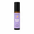 A 10ml roll-on bottle of 'Sleepy Head' aromatherapy oil by 'the wilde magnolia'. The product features a  purple blue label with a yellow crescent moon graphic and white text, housed in an amber glass bottle with a black cap, set against a plain white background.