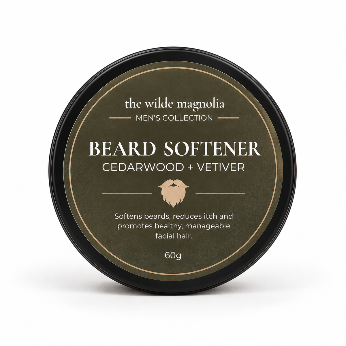 A round black tin with an olive-green label titled "Beard Softener, Cedarwood + Vetiver" by The Wilde Magnolia on a white background.