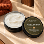 An open black tin of Beard Softener showing the white cream inside